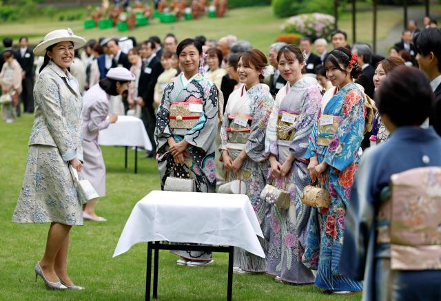 Japan's Princess Tsuguko (L) of Takamado speaks with Japanese medallists of the Milan Cortina Winter Olympics during the spring imperial garden party at the Akasaka Palace's imperial garden in Tokyo on April 17, 2026. (Photo by Franck ROBICHON / POOL / AFP)