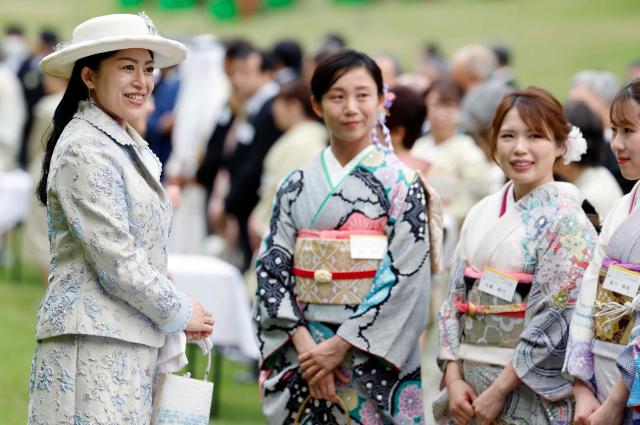 Japan's Princess Tsuguko (L) of Takamado speaks with Japanese medallists of the Milan Cortina Winter Olympics during the spring imperial garden party at the Akasaka Palace's imperial garden in Tokyo on April 17, 2026. (Photo by Franck ROBICHON / POOL / AFP)
