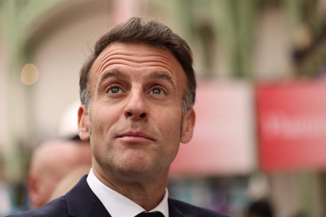 French President Emmanuel Macron visits the Paris Book Fair at the Grand Palais in Paris on April 17, 2026. The fair, which runs until April 19, spotlights comic books as its central theme. (Photo by Teresa SUAREZ / POOL / AFP)