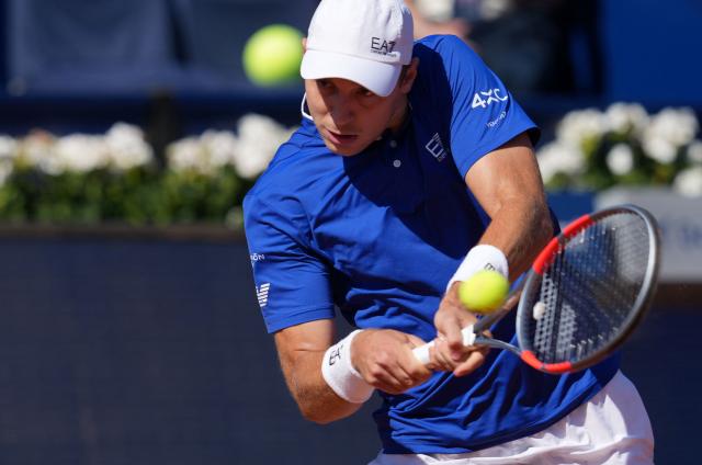 Serbia's Hamad Medjedovic hits a return against Portugal's Nuno Borges during the ATP Barcelona Open "Conde de Godo" tennis tournament quarterfinals tennis match at the Real Club de Tenis in Barcelona, on April 17, 2026. (Photo by Manaure QUINTERO / AFP)