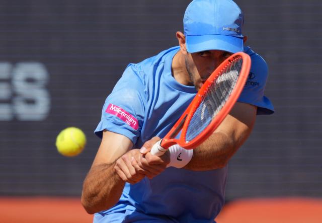 Portugal's Nuno Borges hits a return against Serbia's Hamad Medjedovic during the ATP Barcelona Open "Conde de Godo" tennis tournament tennis match at the Real Club de Tenis in Barcelona, on April 17, 2026. (Photo by Manaure QUINTERO / AFP)