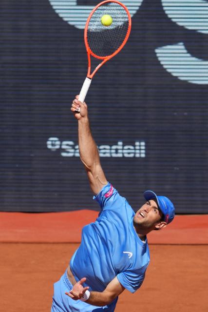 Portugal's Nuno Borges serves to Serbia's Hamad Medjedovic during the ATP Barcelona Open "Conde de Godo" tennis tournament tennis match at the Real Club de Tenis in Barcelona, on April 17, 2026. (Photo by Manaure QUINTERO / AFP)