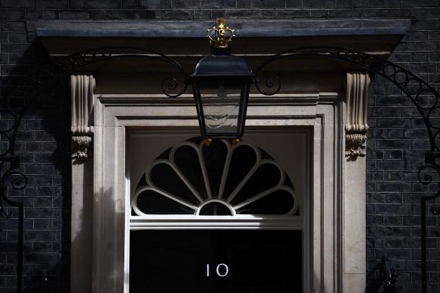 The door to 10 Downing Street, the official residence of Britain's sitting Prime Minister, is pictured in Westminster in central London on April 17, 2026. UK Prime Minister Keir Starmer faced mounting pressure to quit on April l7, over his appointment of Peter Mandelson as envoy to Washington, after it emerged the veteran politician had failed security vetting. (Photo by Henry NICHOLLS / AFP)