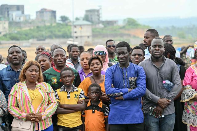 Faithfuls attend the Holy Mass led by Pope Leo XIV at the area in front of Japoma Stadium in Douala on the fifth day of an 11-day apostolic journey to Africa, on April 17, 2026. (Photo by Alberto PIZZOLI / AFP)