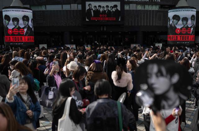 Fans of Korean boy band BTS arrive at Tokyo Dome before the start of the first BTS World Tour ‘Arirang’ in Tokyo on April 17, 2026. Tens of thousands of fans awaited excitedly outside the landmark Tokyo stadium to watch BTS in their first concert outside South Korea after the K-pop megastars kicked off their world tour. (Photo by Andrew CABALLERO-REYNOLDS / AFP)
