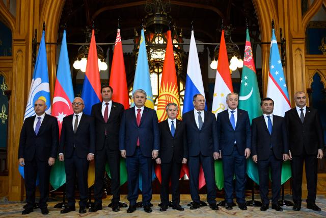 Participants, including Belarusian Foreign Minister Maxim Ryzhenkov, Kazakh Foreign Minister Yermek Kosherbayev, Foreign Minister of Kyrgyzstan Jeenbek Kulubayev, Russia's Foreign Minister Sergei Lavrov, Foreign Minister of Tajikistan Sirojiddin Mukhriddin, Uzbek Foreign Minister Bakhtiyor Saidov, pose for a family photo prior to a meeting of the council of foreign ministers of the Commonwealth of Independent States (CIS) in Moscow on April 17, 2026. (Photo by Alexander NEMENOV / POOL / AFP)