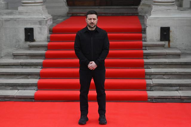Ukraine's President Volodymyr Zelensky waits to welcome Swedish king in Lviv on April 17, 2026, amid the Russian invasion of Ukraine. (Photo by YURIY DYACHYSHYN / AFP)