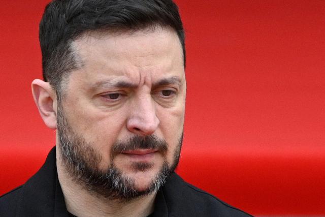 Ukraine's President Volodymyr Zelensky waits to welcome Swedish king in Lviv on April 17, 2026, amid the Russian invasion of Ukraine. (Photo by YURIY DYACHYSHYN / AFP)