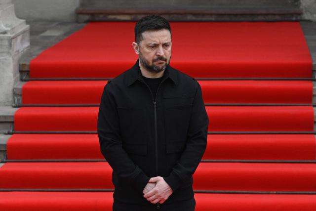Ukraine's President Volodymyr Zelensky waits to welcome Swedish king in Lviv on April 17, 2026, amid the Russian invasion of Ukraine. (Photo by YURIY DYACHYSHYN / AFP)