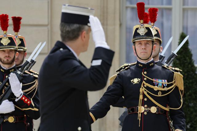 French Republican Guard stand to attention in the courtyard at the presidential Elysee Palace in Paris on April 17, 2026. (Photo by Ludovic MARIN / AFP)