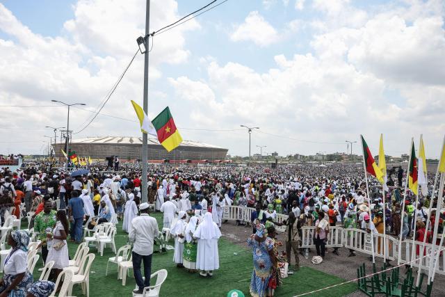 Faithfuls attend the Holy Mass led by Pope Leo XIV at the area in front of Japoma Stadium in Douala on the fifth day of an 11-day apostolic journey to Africa, on April 17, 2026. (Photo by Daniel Beloumou Olomo / AFP)