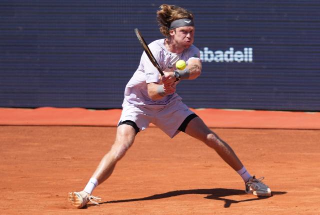 Russia's Andrey Rublev hits a return against Czech Republic's Tomas Machac during the ATP Barcelona Open "Conde de Godo" tennis tournament tennis match at the Real Club de Tenis in Barcelona, on April 17, 2026. (Photo by Manaure Quintero / AFP)
