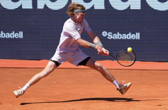 Russia's Andrey Rublev hits a return against Czech Republic's Tomas Machac during the ATP Barcelona Open "Conde de Godo" tennis tournament tennis match at the Real Club de Tenis in Barcelona, on April 17, 2026. (Photo by Manaure Quintero / AFP)
