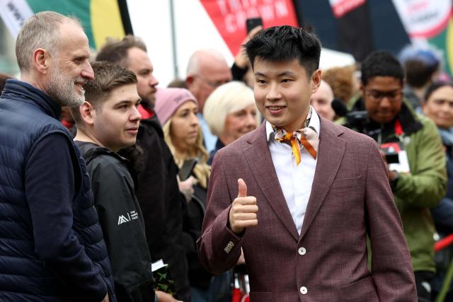 Chinese snooker player Zhao Xintong arrives to attend a media day launching the start of the World Snooker Championship 2026 at Crucible Theatre in Sheffield, northern England, on April 17, 2026. (Photo by Darren Staples / AFP)