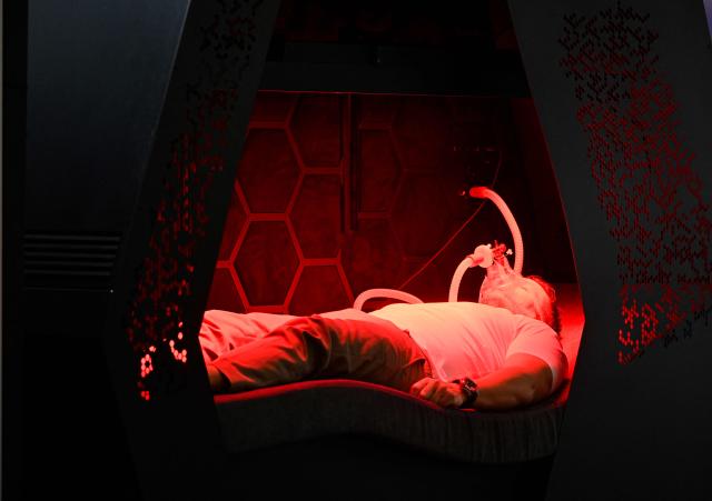 TOPSHOT - A man uses a TUR regenerative Physiotherapy at the FIBO trade show for health, fitness and wellness in Cologne, western Germany on April 17, 2026. (Photo by Ina FASSBENDER / AFP)