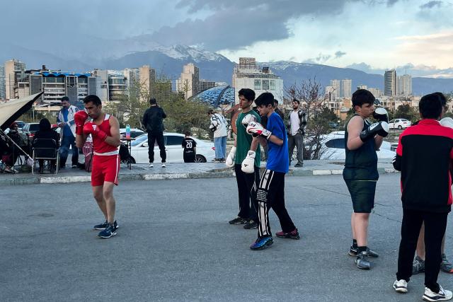 People practice boxing at Pardisan Park in Tehran on April 14, 2026. Iran's foreign ministry welcomed the truce agreed between Israel and Lebanon, calling it part of the earlier two-week ceasefire deal struck between the Islamic republic and the United States to pause the Middle East war, state media reported. (Photo by AFP)