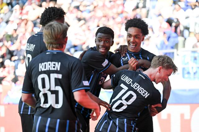 Club Brugge's English defender #90 Andre Garcia (up R) celebrates after scoring his team's second goal during the UEFA Youth League semi-final football match between Benfica and Club Brugge at Stade de la Tuiliere in Lausanne, on April 17, 2026. (Photo by Fabrice COFFRINI / AFP)