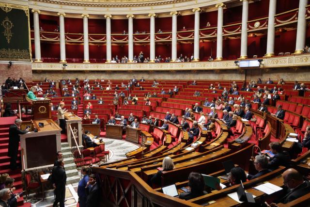 (FILES) Ecologiste et Social's MP Clementine Autain (L) speaks while French MPs attend a debate at the National Assembly, French Parliament lower house, to discuss a proposed low aiming to authorise the work of employees of certain businesses on May 1st, in Paris on April 10, 2026. Prime Minister Sébastien Lecornu expressed concern on April 17, 2026 about a worrying lack of engagement among French Mps, following April 16s failure of a bill on unemployment insurance and after a week of tensions between the government and its allies in the National Assembly. (Photo by Ludovic MARIN / AFP)