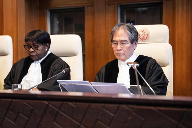 International Court of Justice (ICJ) President Yuji Iwasawa (R) delivers a speech during a celebratory session marking the 80th anniversary of the ICJ in The Hague on April 17, 2026. (Photo by Lina Selg / ANP / AFP) / Netherlands OUT