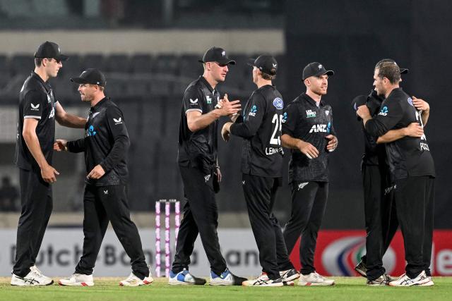 New Zealand's players celebrate their team's win at the end of the first one-day international (ODI) cricket match between Bangladesh and New Zealand at Sher-e-Bangla National Stadium in Mirpur on April 17, 2026. (Photo by Munir UZ ZAMAN / AFP)