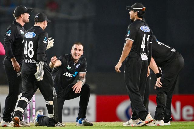 New Zealand's Blair Tickner (C) celebrates with teammates after taking the wicket of Bangladesh's Rishad Hossain during the first one-day international (ODI) cricket match between Bangladesh and New Zealand at Sher-e-Bangla National Stadium in Mirpur on April 17, 2026. (Photo by Munir UZ ZAMAN / AFP)