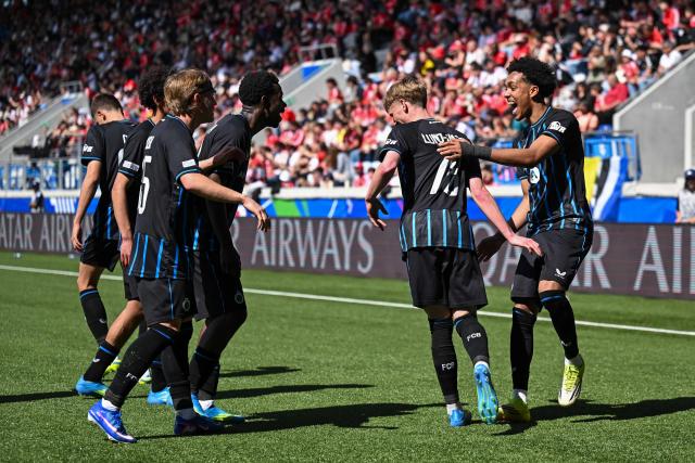 Club Brugge's English defender #90 Andre Garcia (R) celebrates with teammates scoring his team's second goal during the UEFA Youth League semi-final football match between Benfica and Club Brugge at Stade de la Tuiliere in Lausanne, on April 17, 2026. (Photo by Fabrice COFFRINI / AFP)