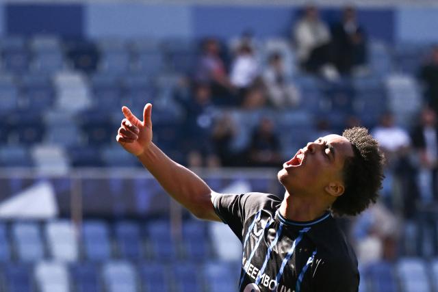 Club Brugge's English defender #90 Andre Garcia celebrates scoring his team's second goal during the UEFA Youth League semi-final football match between Benfica and Club Brugge at Stade de la Tuiliere in Lausanne, on April 17, 2026. (Photo by Fabrice COFFRINI / AFP)