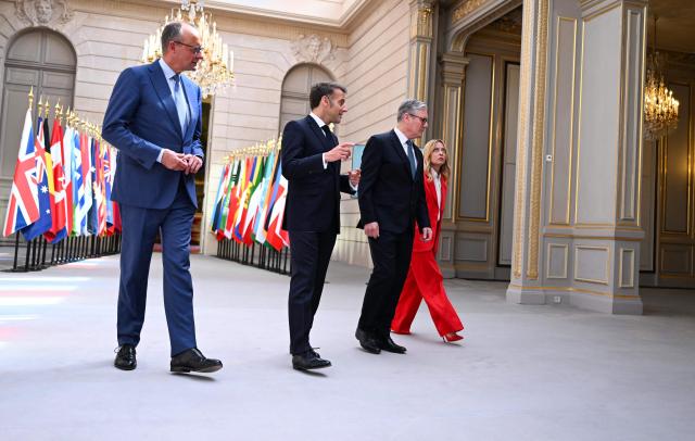 (From L) Germany's Chancellor Friedrich Merz, France's President Emmanuel Macron, Britain's Prime Minister Keir Starmer and Italy's Prime Minister Giorgia Meloni arrive for a press conference following an international summit on efforts to reopen the Strait of Hormuz at the Elysee Presidential Palace in Paris on April 17, 2026. French President Emmanuel Macron and UK Prime Minister Keir Starmer chair a meeting of allies to consider sending a multinational force to ensure security and free-flowing trade in the Strait of Hormuz once the current conflict between Iran and the US and Israel ends. Iran imposed the blockade on the critical shipping bottleneck as soon as the US and Israel launched the war against the Islamic republic on February 28, leading to a surge in global energy prices. Even with a shaky ceasefire in place, the US is now imposing its own blockade on Iranian ports. (Photo by Jeanne Accorsini / POOL / AFP)