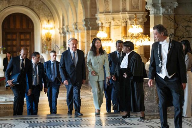 United Nations Secretary-General António Guterres (C,L) and Annalena Baerbock, President of the United Nations General Assembly (C,R) arrive to attend the International Court of Justice (ICJ) celebratory session marking the 80th anniversary of the ICJ in The Hague on April 17, 2026. (Photo by Lina Selg / ANP / AFP) / Netherlands OUT