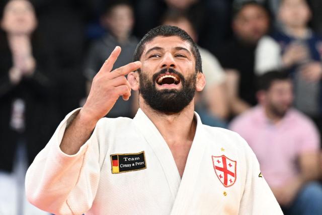 Georgia's Lasha Shavdatuashvili wins against Azerbaijan's Hidayat Heydarov in the men's under 73 kg category gold medal bout at the Judo European Senior Championships 2026 in Tbilisi on April 17, 2026. (Photo by Vano SHLAMOV / AFP)