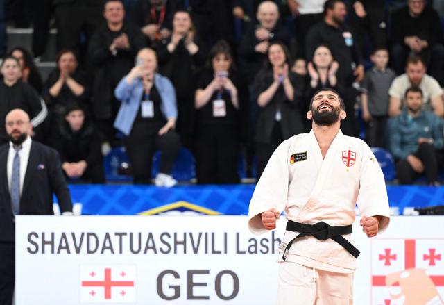 Georgia's Lasha Shavdatuashvili wins against Azerbaijan's Hidayat Heydarov in the men's under 73 kg category gold medal bout at the Judo European Senior Championships 2026 in Tbilisi on April 17, 2026. (Photo by Vano SHLAMOV / AFP)