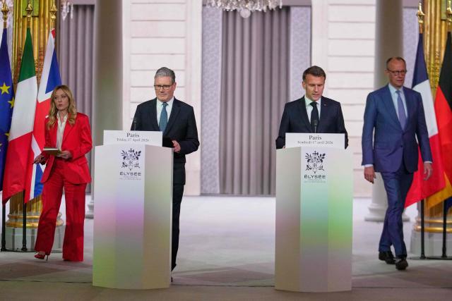 (LtoR) Italian Prime Minister Giorgia Meloni, British Prime Minister Keir Starmer, French President Emmanuel Macron and German Chancellor Friedrich Merz arrive to deliver a joint statement following an international summit on efforts to reopen the Strait of Hormuz at the Elysee Palace in Paris on April 17, 2026. French President Emmanuel Macron and UK Prime Minister Keir Starmer chair a meeting of allies to consider sending a multinational force to ensure security and free-flowing trade in the Strait of Hormuz once the current conflict between Iran and the US and Israel ends. Iran imposed the blockade on the critical shipping bottleneck as soon as the US and Israel launched the war against the Islamic republic on February 28, leading to a surge in global energy prices. Even with a shaky ceasefire in place, the US is now imposing its own blockade on Iranian ports. (Photo by Michel Euler / POOL / AFP)