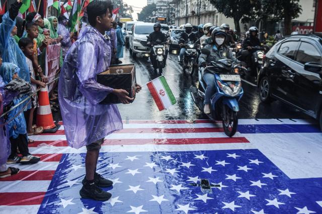 Muslims take part in a rally condemning US-Israeli attacks on Iran and Israeli attacks on Lebanon and Palestine, in Bandung, West Java, on April 17, 2026. (Photo by Timur Matahari / AFP)