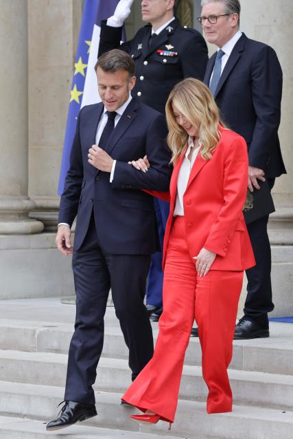 France's President Emmanuel Macron (L) followed by Britain's Prime Minister Keir Starmer, talks to Italian Prime Minister Giorgia Meloni in the courtyard at the end of a meeting of allies to consider sending a multinational force to ensure security and free-flowing trade in the Strait of Hormuz, at the presidential Elysee Palace in Paris on April 17, 2026. Emmanuel Macron on April 17, 2026 urged the unconditional reopening of the Strait of Hormuz after Tehran declared that the key shipping route would be open as long as a ceasefire in the Middle East lasts. (Photo by Ludovic MARIN / AFP)