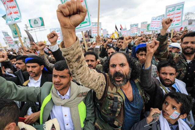 Supporters of the Iran-backed Houthi movement brandish their weapons as they rally in solidarity with Iran and Lebanon in the Yemeni capital Sanaa on April 17, 2026. The Middle East war has created an "unprecedented shock" for the region's economies with no guarantee of a quick recovery, a senior International Monetary Fund official has told AFP. Five of the Gulf's eight oil- and gas-producing countries face a contraction this year, the IMF said in a regional report published on April 16. (Photo by Mohammed HUWAIS / AFP)