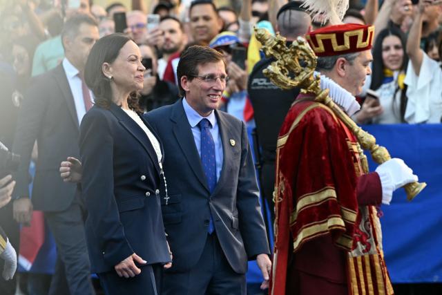 Venezuelan opposition leader Maria Corina Machado (L) arrives with Madrid Mayor Jose Luis Martinez-Almeida to attend a ceremony to receive the Golden Key to the City, in Madrid, on April 17, 2026. Spain's right-wing parties showed their support for Venezuelan opposition figure and Nobel Peace Prize winner Maria Corina Machado in Madrid today. Machado turned down a meeting with the country's leftist PM, Pedro Sanchez, considering it 'unsuitable' for the moment. (Photo by Javier SORIANO / AFP)