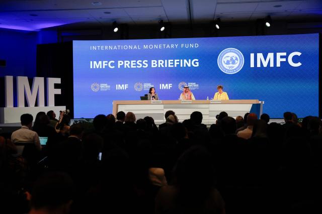 (L/R) IMF Communications Department Director Julie Kozack, Saudi Arabia's Finance Minister Mohammed Al-Jadaan and IMF Managing Director Kristalina Georgieva speak during a press briefing following a meeting of the IMFC (International Monetary and Financial Committee) at the 2026 IMF and World Bank Group Spring Meetings in Washington, DC, on April 17, 2026. (Photo by Kent NISHIMURA / AFP)