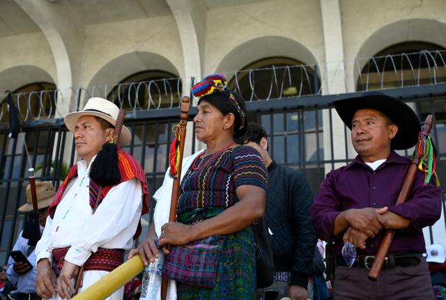 People protest against the nomination of Consuelo Porras for a third term as attorney general outside the Palace of Justice in Guatemala City on April 17, 2026. The official is seeking a third four-year term despite the United States, Canada, the United Kingdom and the European Union, along with around a dozen allied countries, revoking her visa for undermining democracy. (Photo by Johan ORDONEZ / AFP)