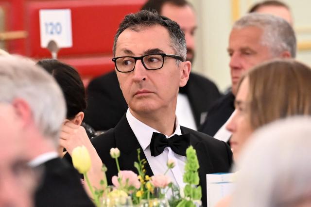 Cem Ozdemir, politician of the Greens party, is pictured at the dinner table during the Bundespresseball (German Federal Press Ball) in Berlin, Germany, on April 18, 2026. (Photo by Annette Riedl / POOL / AFP)