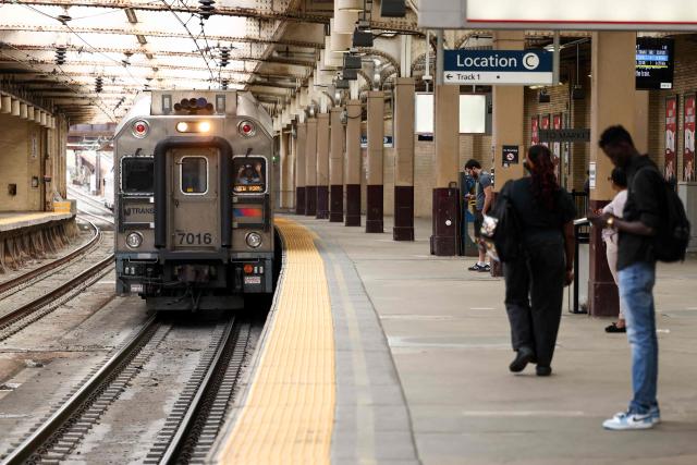 An NJ Transit train bound for New York pulls into Newark Penn Station in Newark, New Jersey on April 17, 2026. Football fans have expressed outrage at the exorbitant price of transit fares to get to World Cup matches, following reports that US transport authorities have jacked up prices just for this summer's tournament. New Jersey Transit is planning to charge fans more than $100 for tickets from Penn Station in Manhattan to MetLife Stadium in New Jersey during the World Cup, according to a report in The Athletic. A return ticket for the journey normally costs $12.90. (Photo by CHARLY TRIBALLEAU / AFP)
