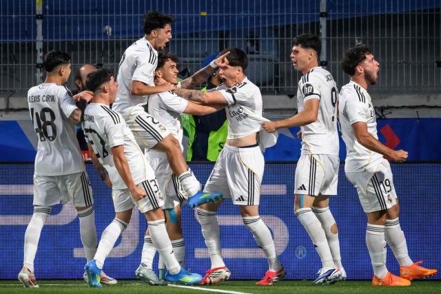 Real Madrid's players celebrate scoring their team first goal during the UEFA Youth League semi-final football match between Real Madrid and Paris Saint-Germain at Stade de la Tuiliere in Lausanne, on April 17, 2026. (Photo by Fabrice COFFRINI / AFP)