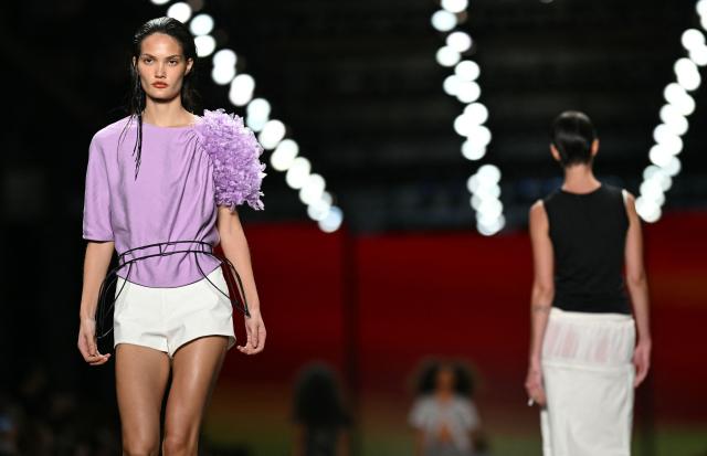 Models present creations by Angela Brito during Rio Fashion Week at Pier Maua in Rio de Janeiro, Brazil, on April 17, 2026. (Photo by Mauro PIMENTEL / AFP)