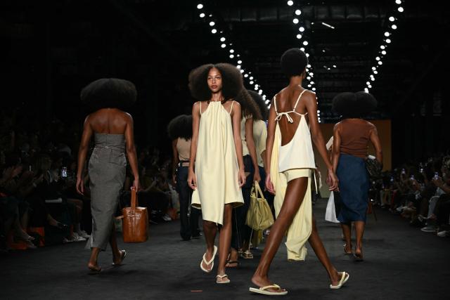 Models present creations by Angela Brito during Rio Fashion Week at Pier Maua in Rio de Janeiro, Brazil, on April 17, 2026. (Photo by Mauro PIMENTEL / AFP)