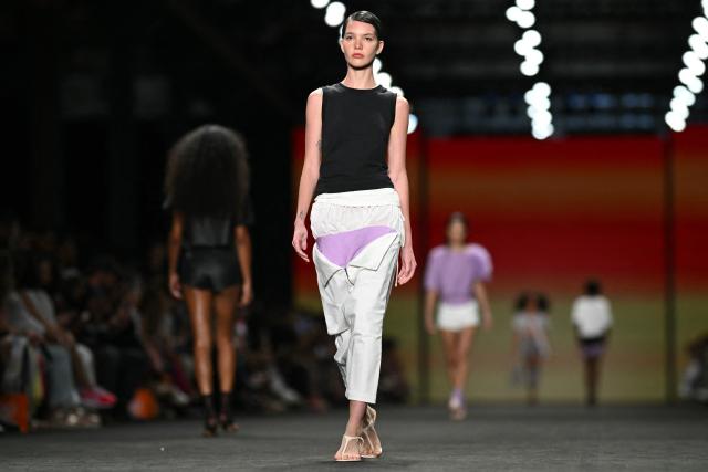A model presents a creation by Angela Brito during Rio Fashion Week at Pier Maua in Rio de Janeiro, Brazil, on April 17, 2026. (Photo by Mauro PIMENTEL / AFP)