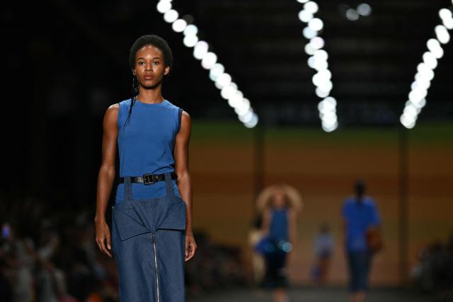 A model presents a creation by Angela Brito during Rio Fashion Week at Pier Maua in Rio de Janeiro, Brazil, on April 17, 2026. (Photo by Mauro PIMENTEL / AFP)