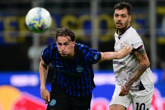 Inter Milan’s Italian forward #94 Francesco Pio Esposito fights for the ball with Cagliari’s Italian midfielder #10 Gianluca Gaetano during the Italian Serie A football match between Inter Milan and Cagliari at San Siro stadium in Milan, on April 17, 2026. (Photo by MARCO BERTORELLO / AFP)