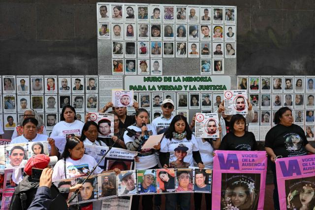 Members of the collective for the search of missing persons, “Una Luz en el Camino,” take part in a press conference at the so?called Wall of Memory for Truth and Justice, located at the headquarters of the Comprehensive Care Center for the Search for Persons in Mexico City, on April 17, 2026. Several groups searching for missing persons announced on April 17 the discovery of more than 1,000 bone fragments in a lakeside area of Mexico City, where Mexican authorities have been carrying out excavations for more than a week. (Photo by Yuri CORTEZ / AFP)