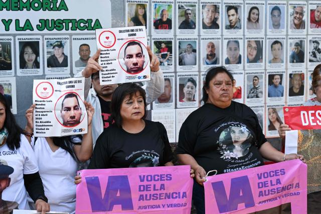 Members of the collective for the search of missing persons, “Una Luz en el Camino,” take part in a press conference at the so?called Wall of Memory for Truth and Justice, located at the headquarters of the Comprehensive Care Center for the Search for Persons in Mexico City, on April 17, 2026. Several groups searching for missing persons announced on April 17 the discovery of more than 1,000 bone fragments in a lakeside area of Mexico City, where Mexican authorities have been carrying out excavations for more than a week. (Photo by Yuri CORTEZ / AFP)