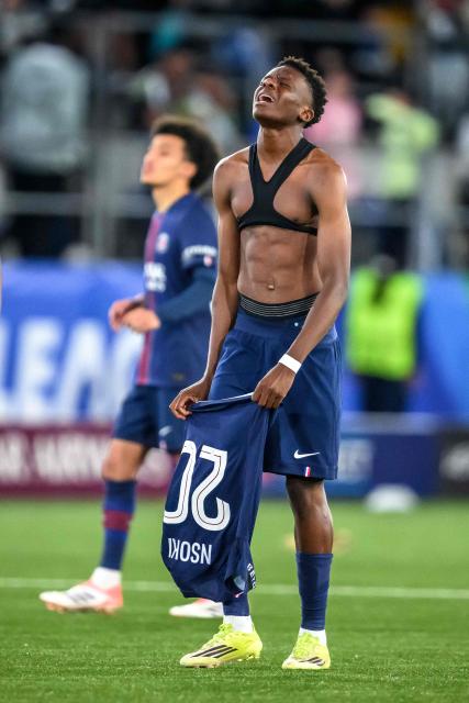 Paris Saint-Germain's French midfielder #20 Noah Nsoki reacts after his team lost the penalty shoot-out of the UEFA Youth League semi-final football match between Real Madrid and Paris Saint-Germain at Stade de la Tuiliere in Lausanne, on April 17, 2026. (Photo by Fabrice COFFRINI / AFP)