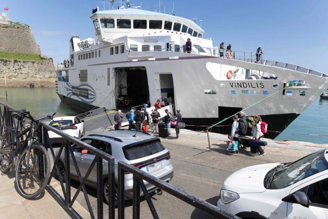Cars embark on a ferry in Belle-Ile-en-Mer, western France, on April 17, 2026. (Photo by Fred TANNEAU / AFP)